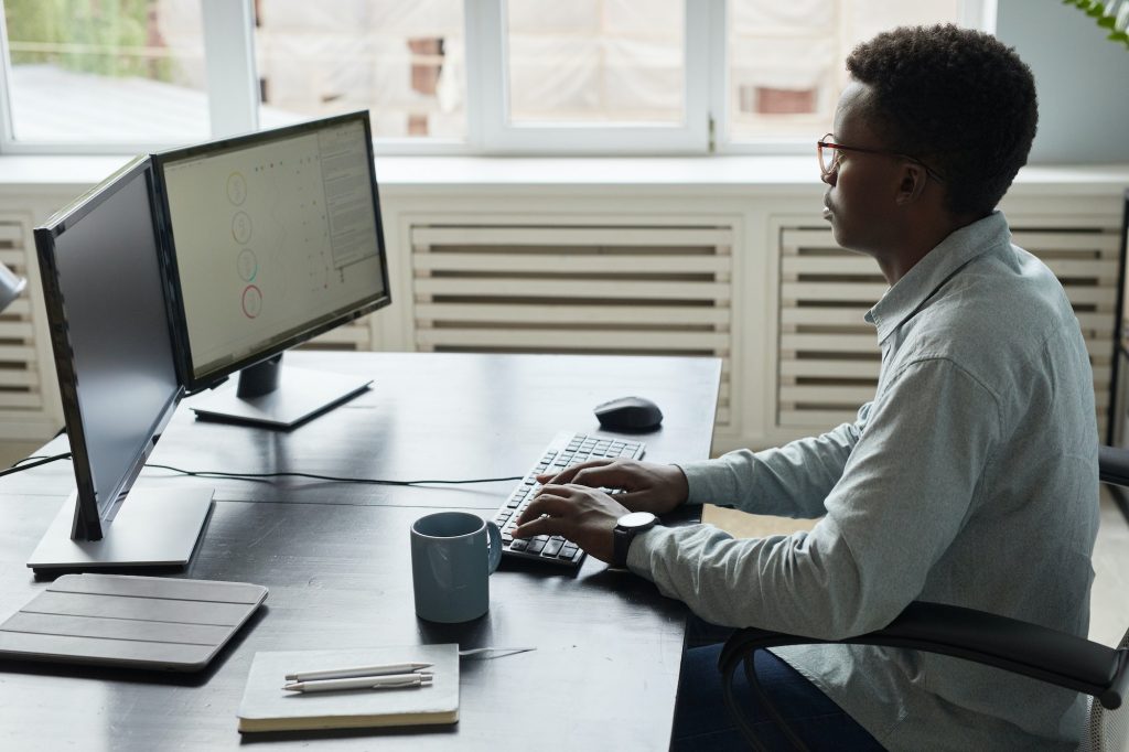 African American Man Working at Desk