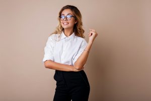 Attractive successful business woman with candid smile looking at camera